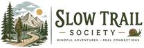 Logo of the Slow Trail Society with a person on a trail and mountains in the background.