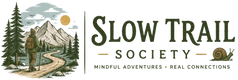 Logo of the Slow Trail Society with a person on a trail and mountains in the background.